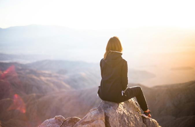 Girl stares into canyon